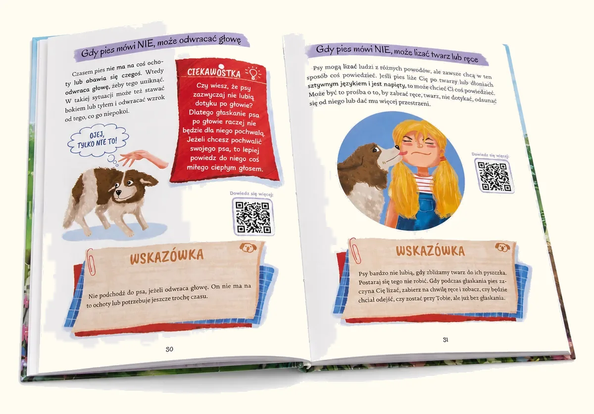 Otwarta książka na rozkładówce o tym, jak pies mówi NIE: odwraca głowę albo liże twarz i ręce